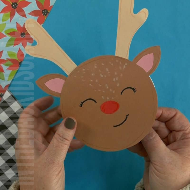 A DIY reindeer card featuring a fun and festive design, perfect as a Christmas card or Christmas craft for kids to create their own personalized holiday greetings.