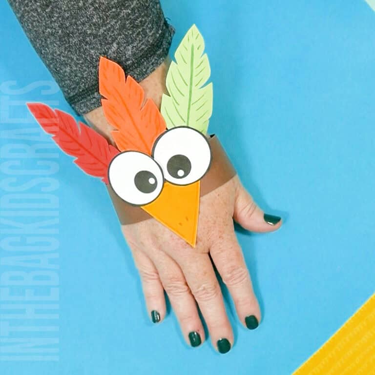 A colorful paper puppet of a turkey designed as a preschool craft for Thanksgiving, perfect as a fall craft activity for kids.