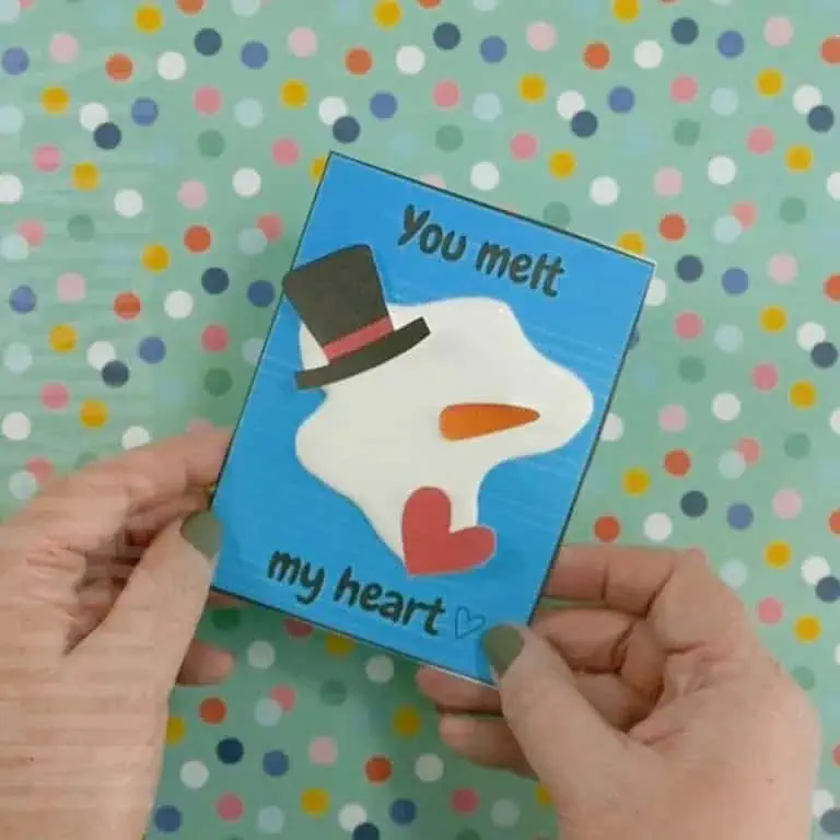 A handmade valentine card featuring a melted snowman design, perfect for a heartfelt Valentine's Day craft that kids and adults will love making.