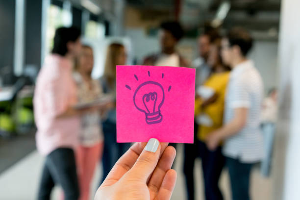 drawing of a bulb on a pink paper