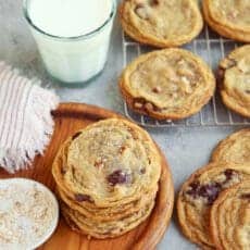 Cookies cooling on rack with milk.