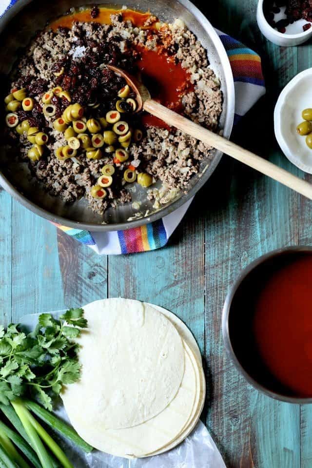 Beef Enchiladas with Green Olive and Raisins