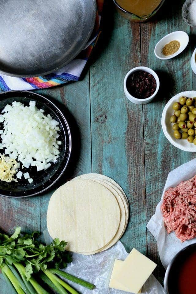 Beef Enchiladas with Green Olive and Raisins