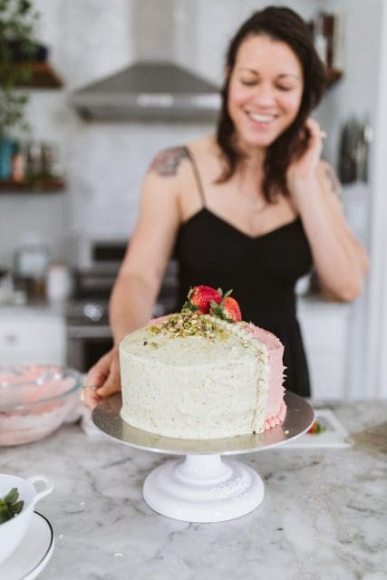 Pistachio side of cake on a cake stand.