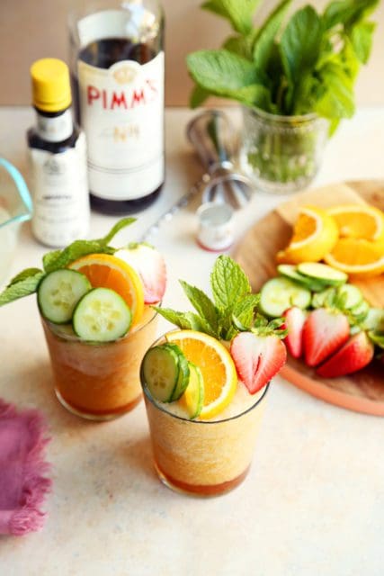 Best batch cocktail for summer blended and served in two glasses with fruit and mint