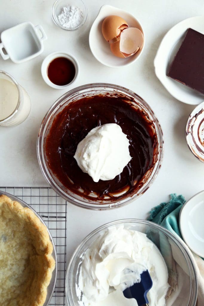 Whipped cream folded into chocolate mixture for french silk pie recipee
