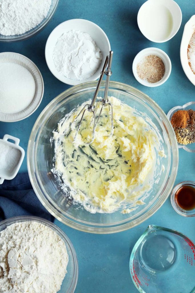 Butter and sugar in a glass bowl.