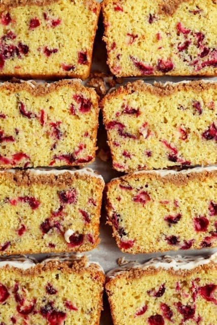 Closeup of slice of cranberry orange bread.