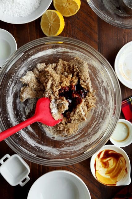 Gingerbread almond flour cookie dough with molasses in a clear bowl