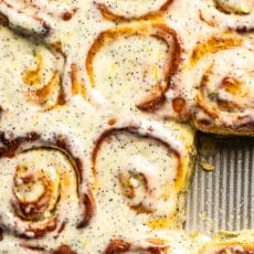 Close up of lemon poppy seed rolls in the baking pan.