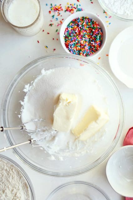 Sugar, shortening and butter in a large bowl with beaters.