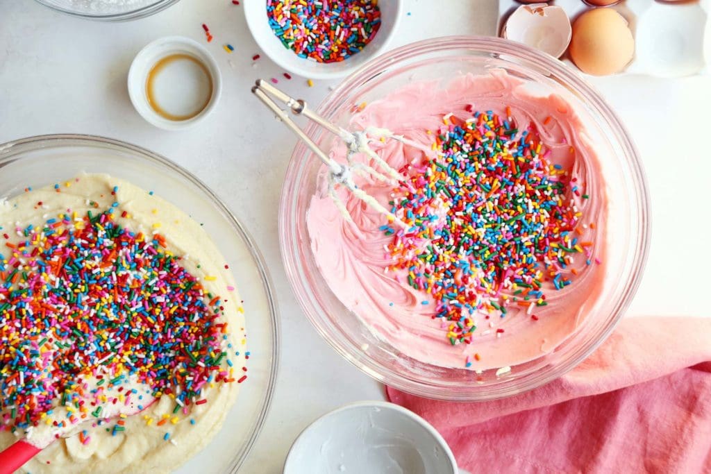 Cake batter tinted pink and sprinkles added for funfetti cake.