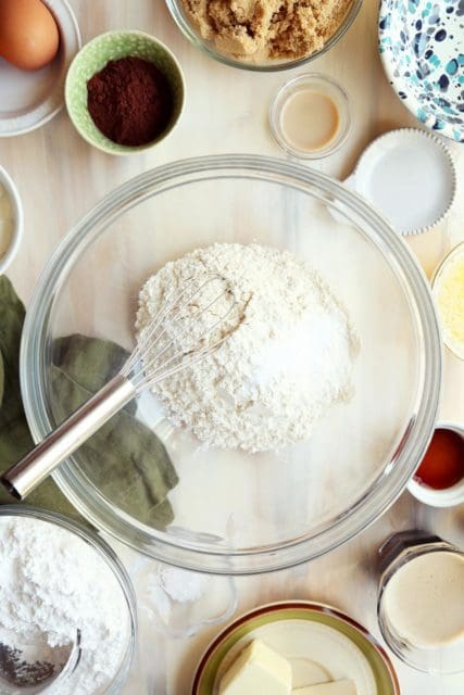 Whisking together dry ingredients in a bowl.