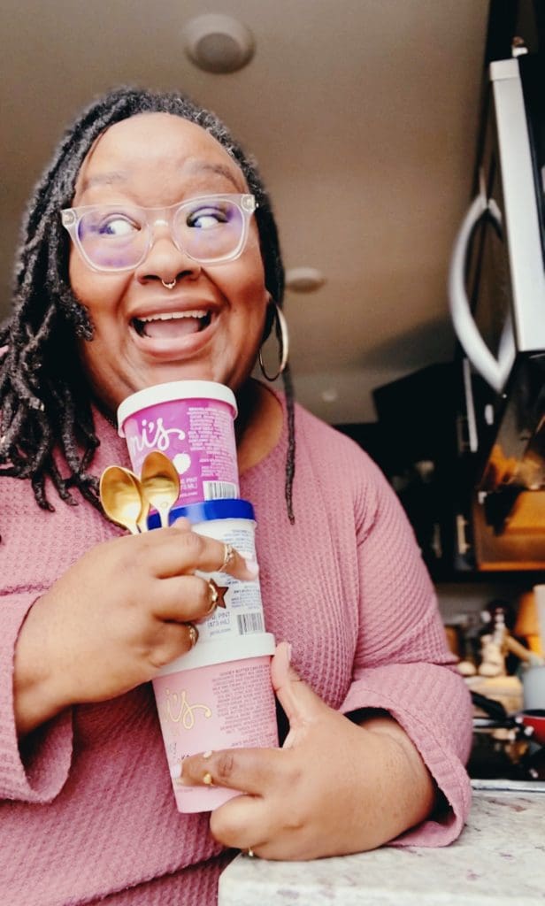 Abby holding three pints of Jeni's Ice Cream for review.