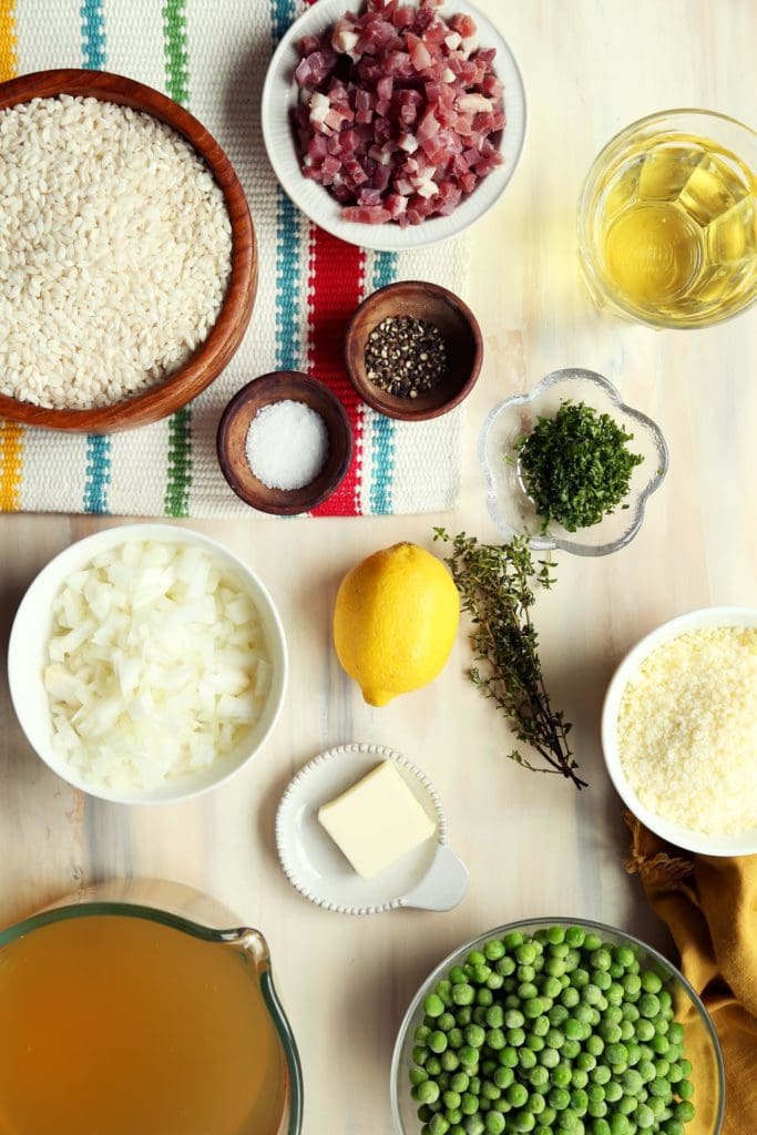 Ingredients for easy risotto recipe measured in small bowls.