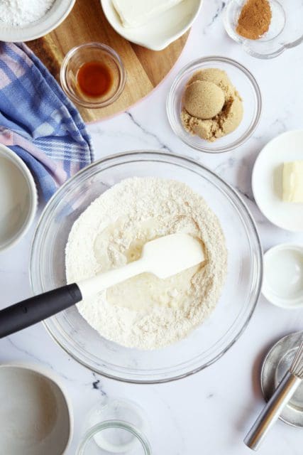 mixing single serve cinnamon roll ingredients together with spatula