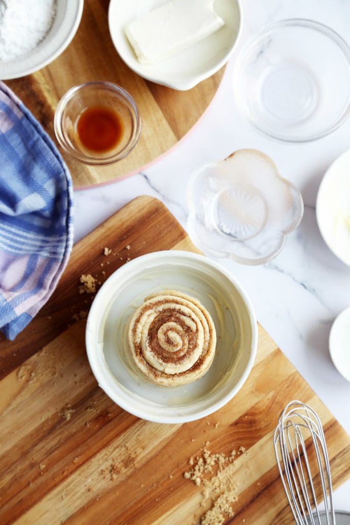 single serve cinnamon roll in small ramekin to rise