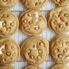 Baked fluffernutter cookies with gooey marshmallow peeking out.