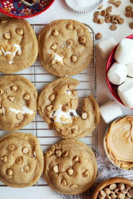Baked fluffernutter cookies broken apart on wire rack.