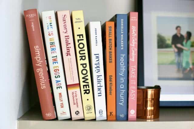 Stack of cookbooks on shelf