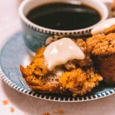 melted pumpkin muffins on a plate with coffee