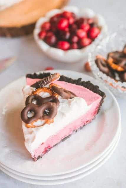 Slice of fluffy, creamy cranberry pie on a small plate.