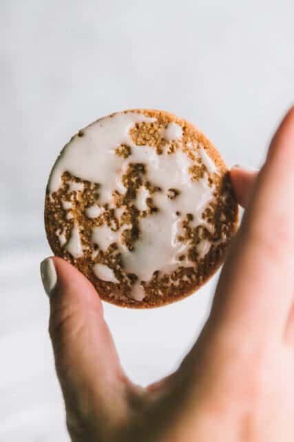 Holding up a perfect iced oatmeal cookie.