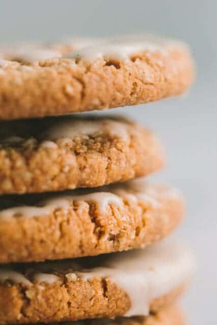A stack of iced oatmeal cookies.