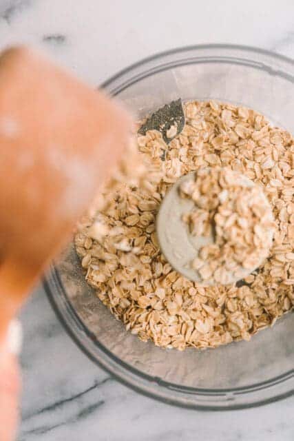 Pouring oatmeal into food processor