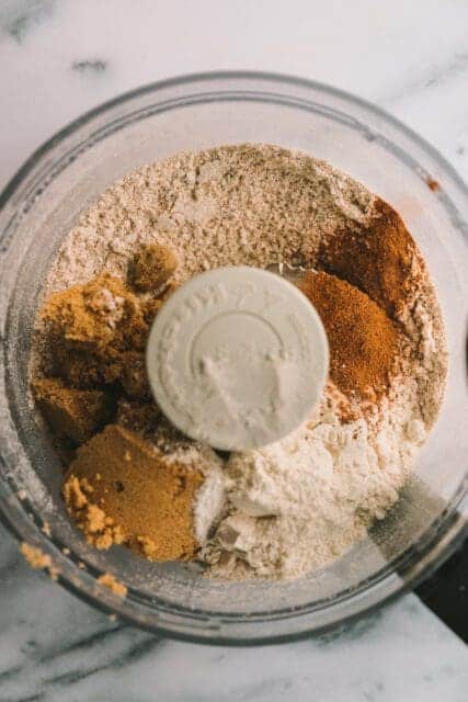 Adding dry ingredients to food processor.