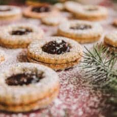 Dusted linzer cookies dusted with powdered sugar.