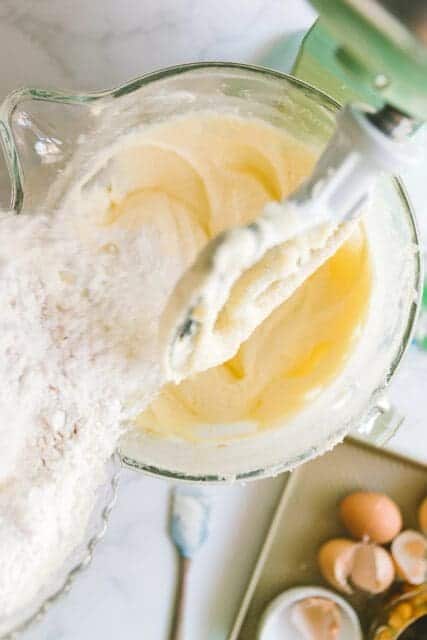 combining ingredients in a stand mixer fitted with paddle attachment