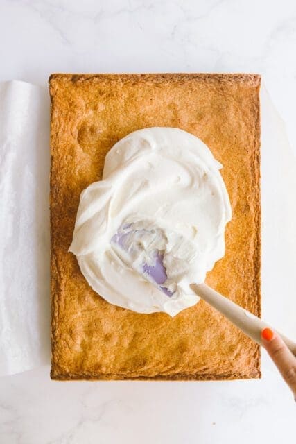 spreading frosting on 4th of July cake