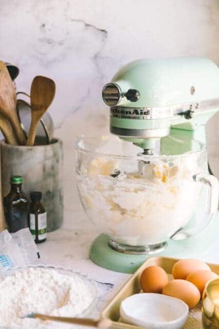 sifting ingredients to add to make a cake
