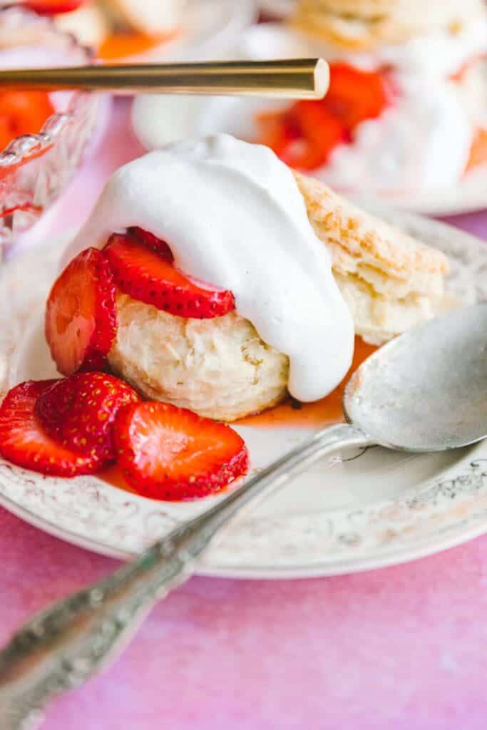 finished strawberry shortcake recipe with soft whipped cream on top