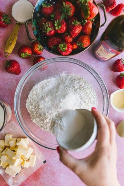 adding ingredients to make shortcake