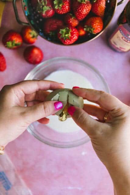 adding eggs into cold cream