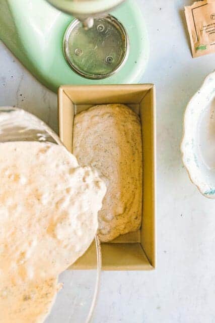 layering soft cream into a loaf pan to freeze into coffee ice cream