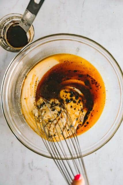 stirring coffee into ingredients to make coffee ice cream