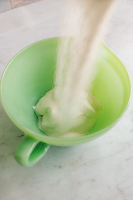mixing sour cream and sugar for kolache recipe