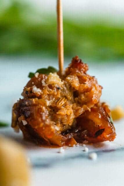 single stuffed date with a toothpick in it for a party