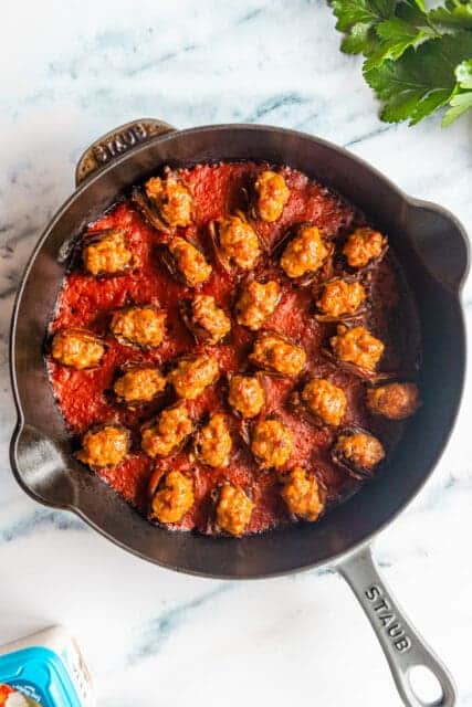 sausage stuffed dates in tomato sauce