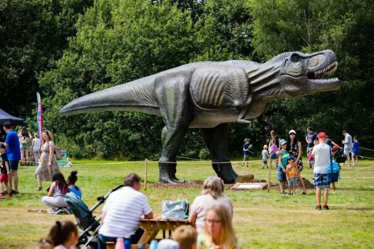 Giant T-rex model stands in the park