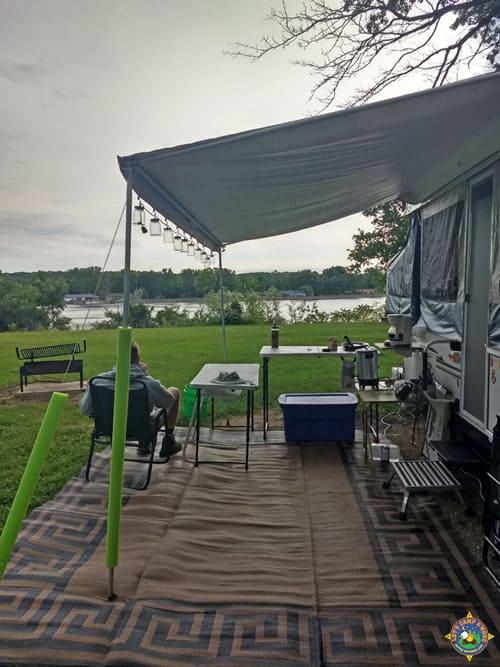 man looking at the river from a campsite at Illini State Park