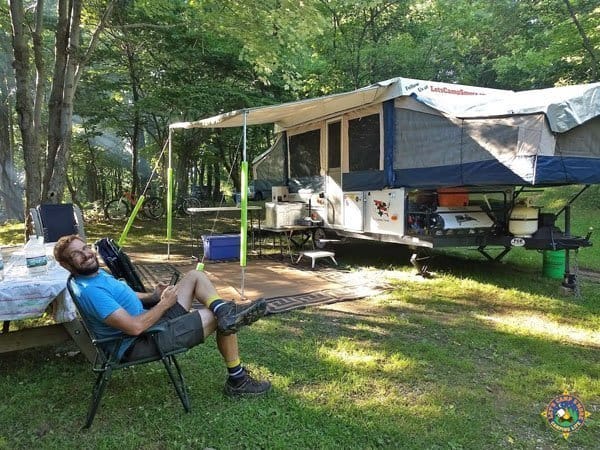 Man camping at Tomlinson Run on site 12