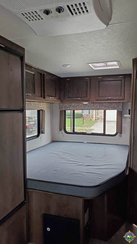 thin queen RV mattress inside a motorhome