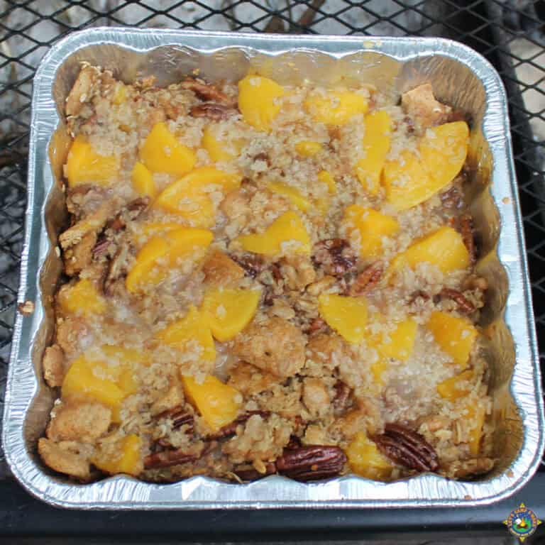 close up of peach cobbler made over a campfire