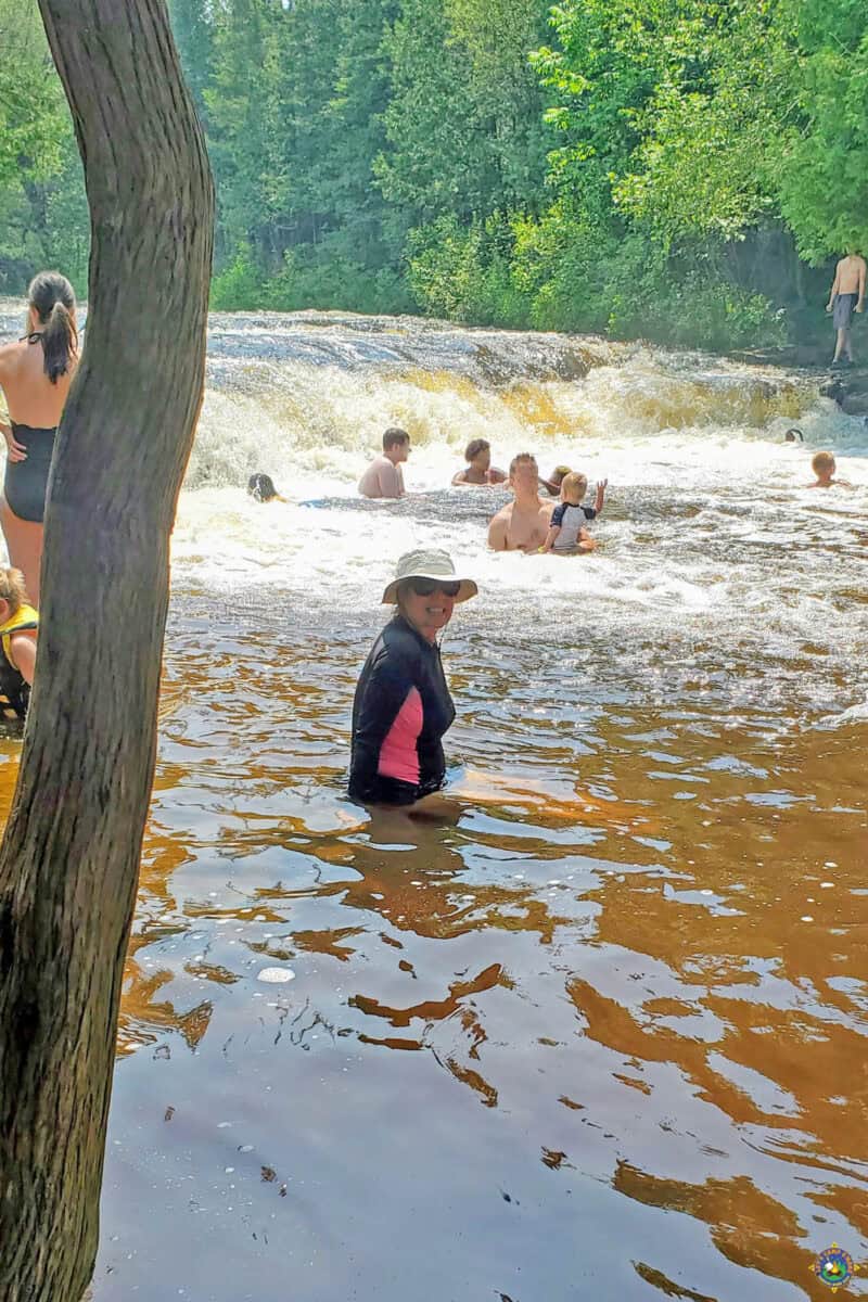 a woman Swimming at Ocqueoc Falls State Park