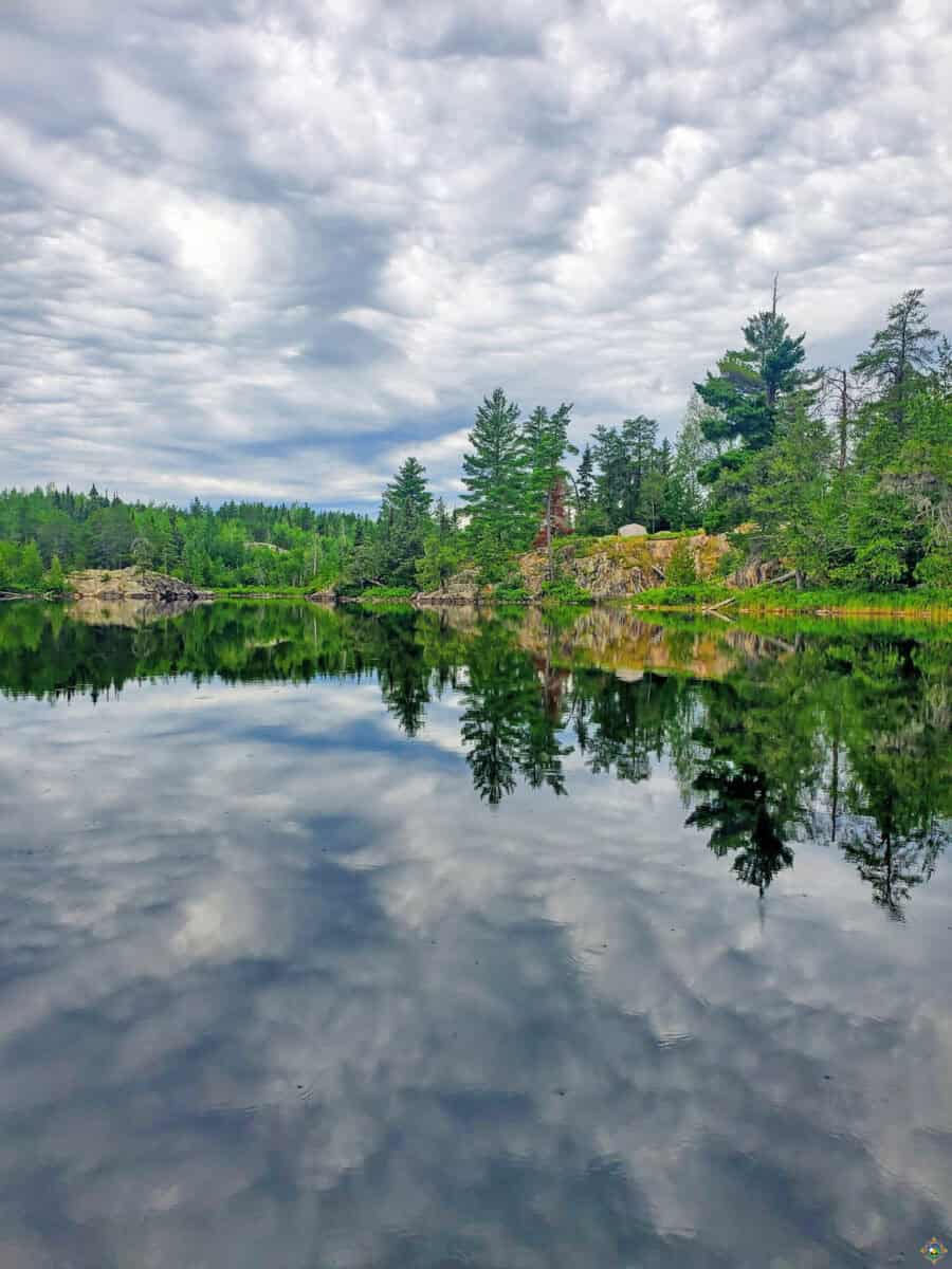 clouds reflecting in a lake in the boundary waters