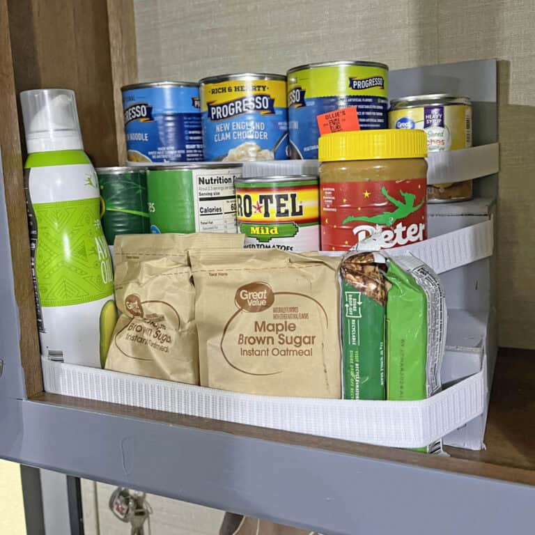 tiered storage shelf for an RV with food on it